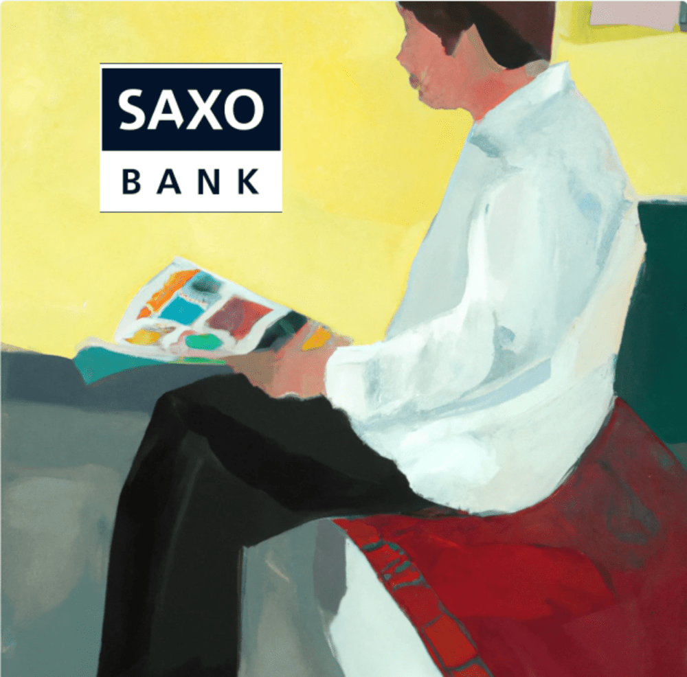 Person sitting down reviewing Saxo Bank